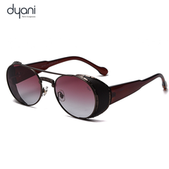 The NightRider sunglasses with steampunk-inspired wraparound frame and smoked red gradient lenses by Dyani.