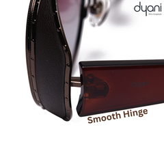 Close-up of The NightRider sunglasses, showing the smooth hinge and sleek wraparound frame with smoked red gradient lenses.