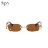 The Rebel sunglasses with gold metal frame, chain-link bridge, rectangular lenses, and wide black arms. Unisex UV400 protection.