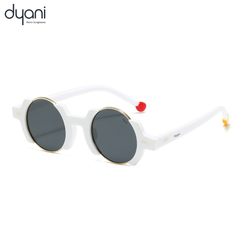 Retro round sunglasses with black and gold gradient lenses, white frame, and red and gold temple tips by Dyani.