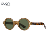 The Joplin round sunglasses with keyhole bridge and tortoiseshell temples by Dyani, blending vintage style with modern groove.