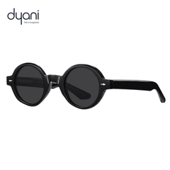 The Joplin vintage round sunglasses with black frames, keyhole bridge, and retro style by Dyani.