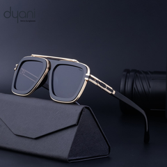 Stylish Dyani sunglasses with bold square frames, featuring blue gradient lenses, resting on a sleek black case for modern flair.