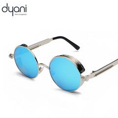 Alt Tag: Dyani Eclipse round steampunk sunglasses with a metal frame and blue lenses, perfect for 70s-inspired festival fashion.