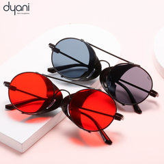 Three Aviatix sunglasses with round frames and dark lenses on a pink and white background, perfect for desert festivals and parties.