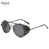 Sleek black Aviatix sunglasses with round frames and side shields, perfect for festivals, desert adventures, or Burning Man parties.