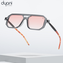 Prismatik sunglasses with sharp-angled frame, translucent hues, and colorful lens tints for city and rooftop scenes.