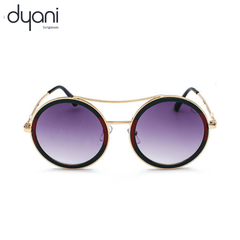 The Altair round-lens sunglasses with metal detailing in gradient purple, showcasing a bohemian and rockstar-inspired style.