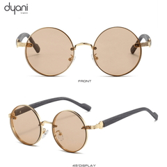 The Orbis round sunglasses with ornate temples and tan lenses, offering old school charm and modern attitude. Cool festival eyewear.
