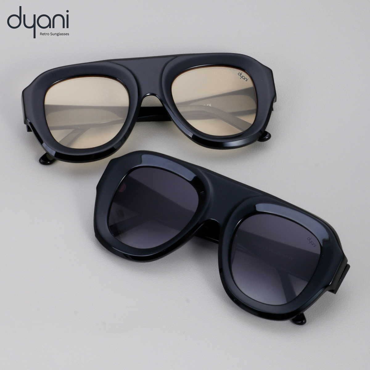 Velora sunglasses by Dyani with bold acetate frame and gradient UV400 lenses, blending retro and modern styles in sleek black.