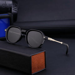 Modern black sunglasses with matte silver accents and polarized lenses, perfect for a stylish urban look.