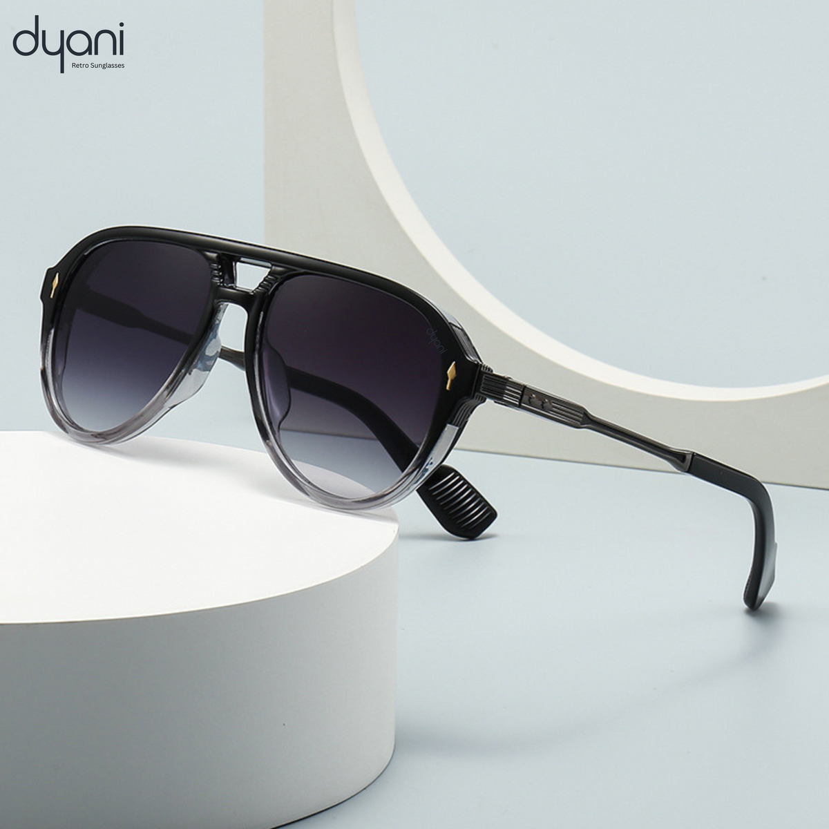 Dyani The Sovereign aviator sunglasses, bold black lenses, white temples, modern half-frame design.