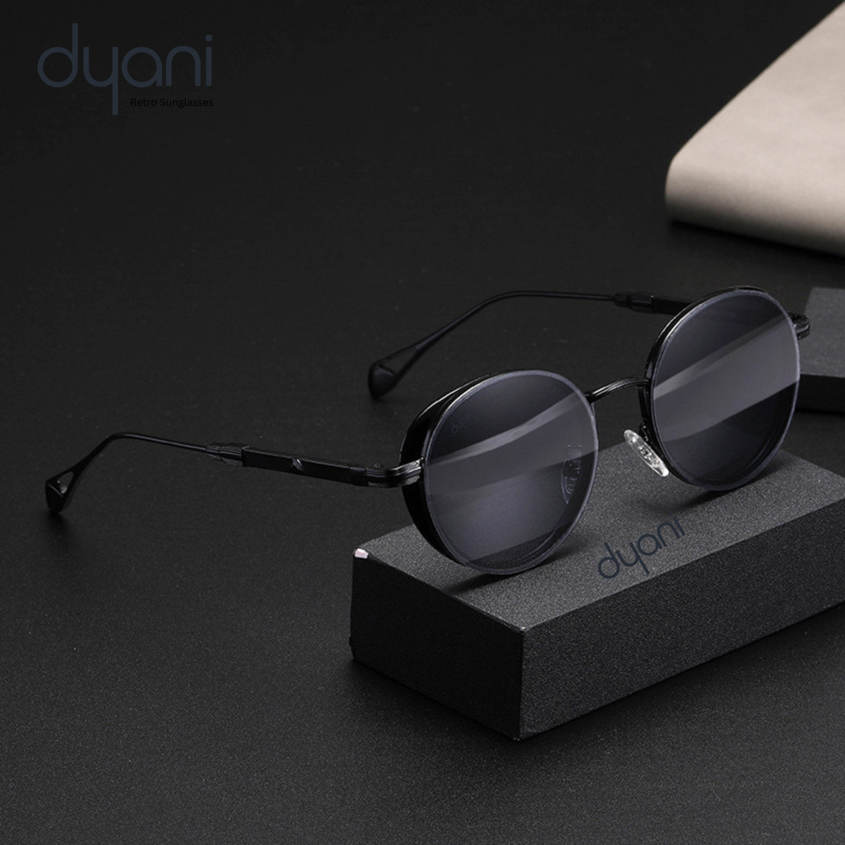 The Luna steampunk round sunglasses with vintage charm and contemporary sophistication on a display stand.