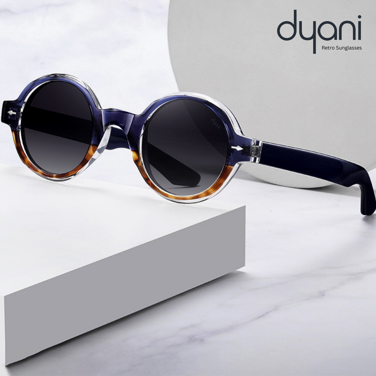 Round sunglasses with earthy tones and tortoiseshell temples by Dyani, featuring retro-inspired design and modern flair.