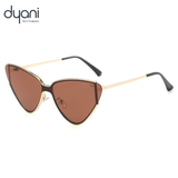 Dyani cat-eye sunglasses with a gold frame and dark lenses on a white background