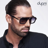 Man wearing Dyani Stratos sunglasses with square frames and blue gradient lenses, showcasing bold style and elegance.