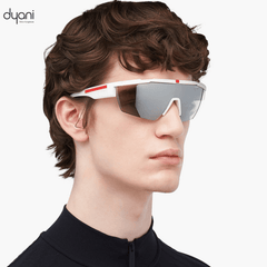 Person wearing The VantaX sunglasses with a wraparound shield frame in sleek black, showcasing lightweight and sporty design.