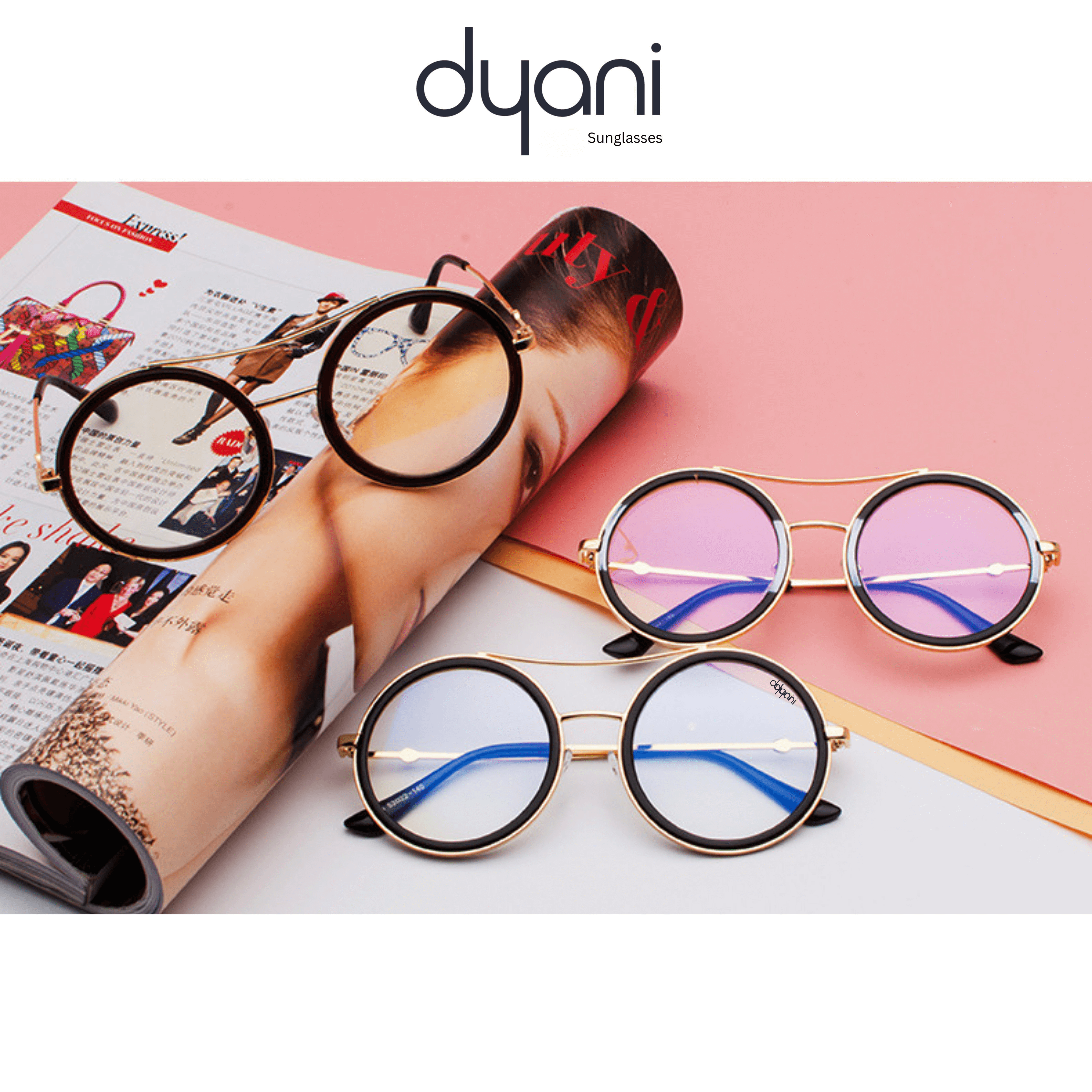 The Altair round-lens sunglasses with metal detailing, in gradient purple and blue, on a magazine.