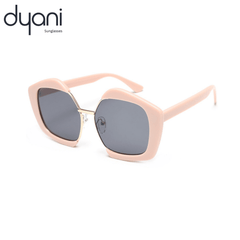 The Bellara sunglasses with high-volume square frame and metal bridge, in muted rose color by Dyani Eyewear, perfect fashion accessory.