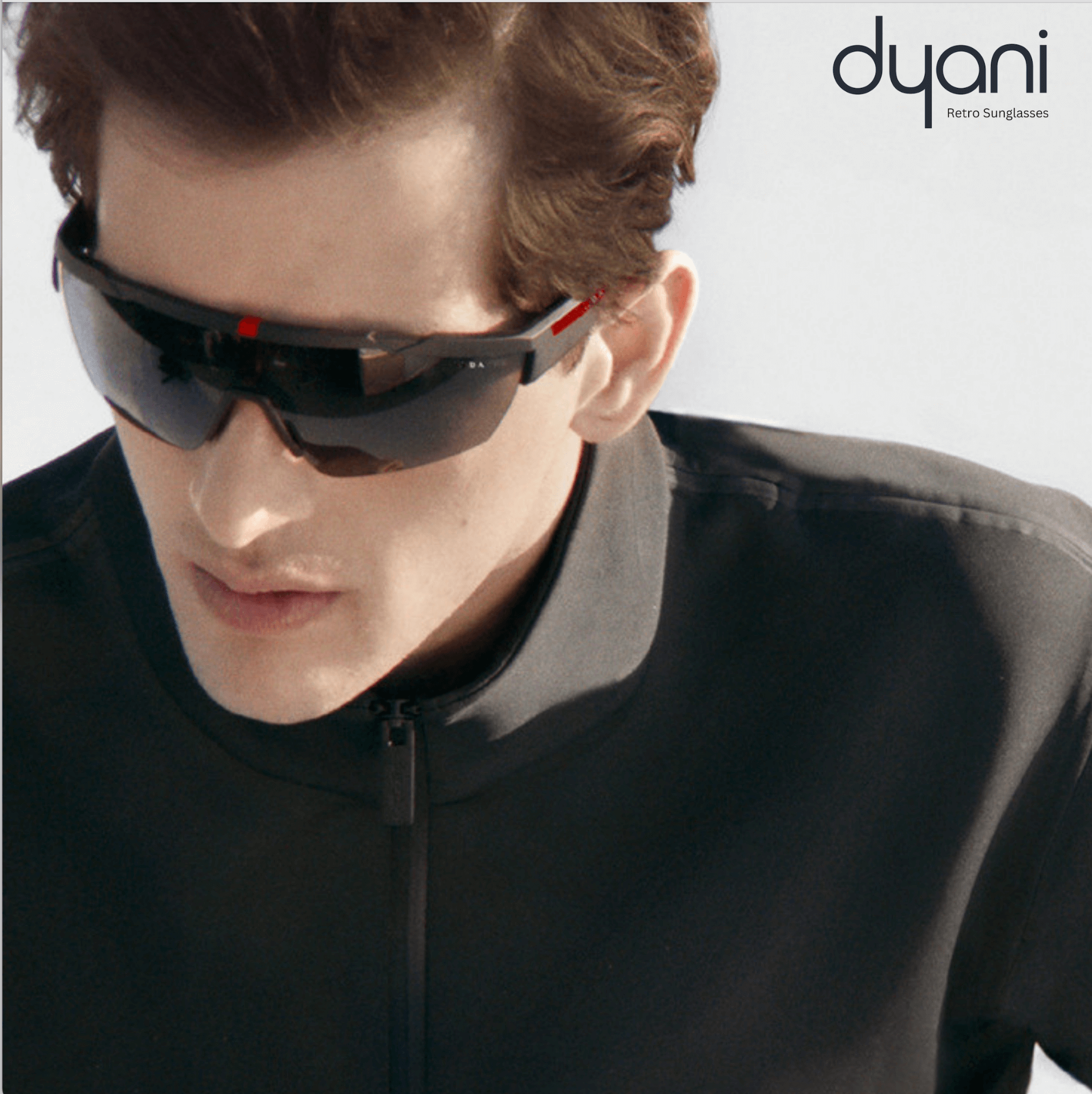 Model wearing The VantaX sunglasses with a wraparound shield frame in sleek black, showcasing sporty, lightweight design.