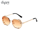 Sunglasses with orange gradient lenses and gold frame on a white background, featuring the Dyani brand.