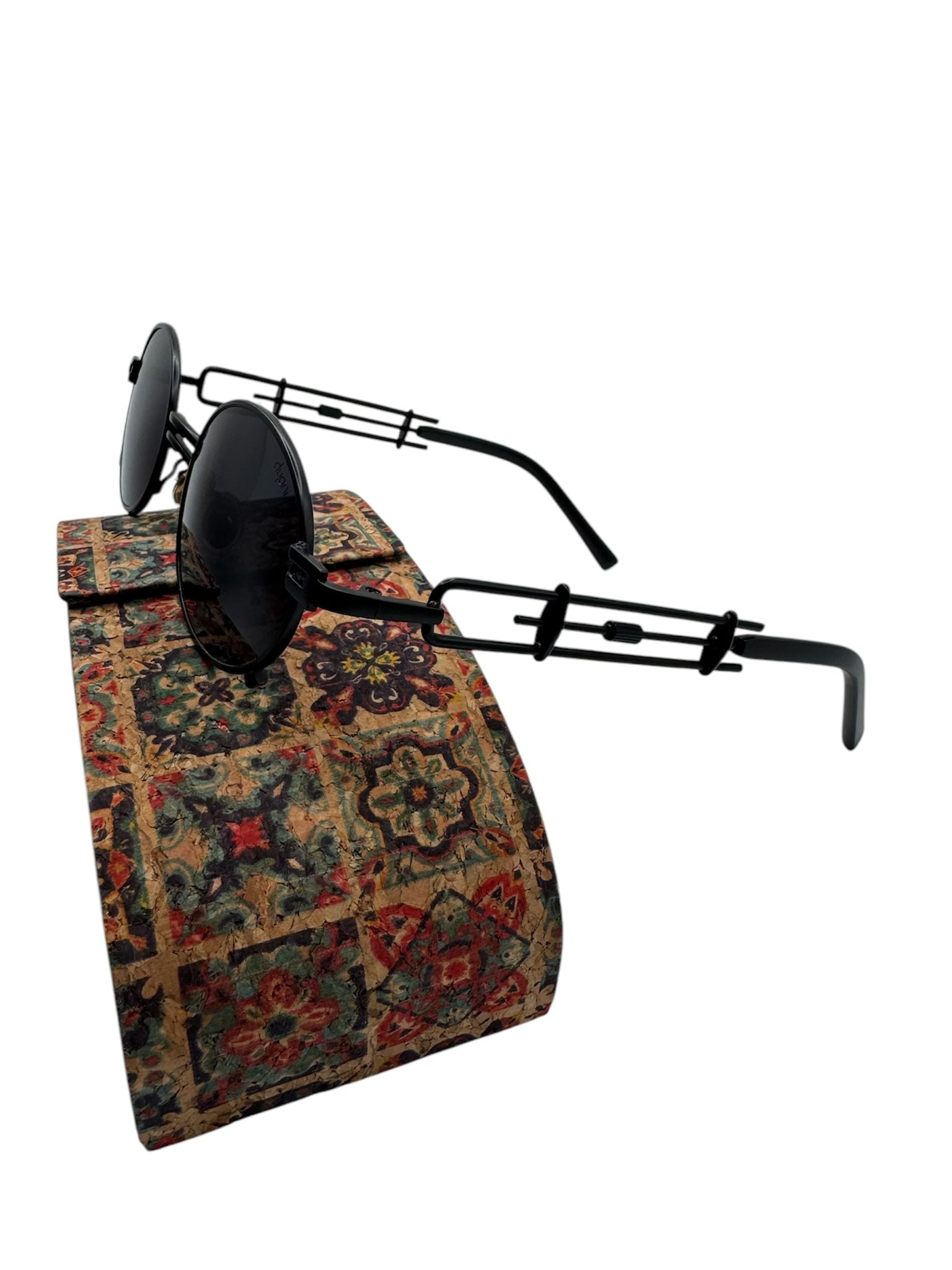 JazzyOval Metal Frame Retro Shades with unique handles, featuring smooth oval lenses on a patterned fabric display.
